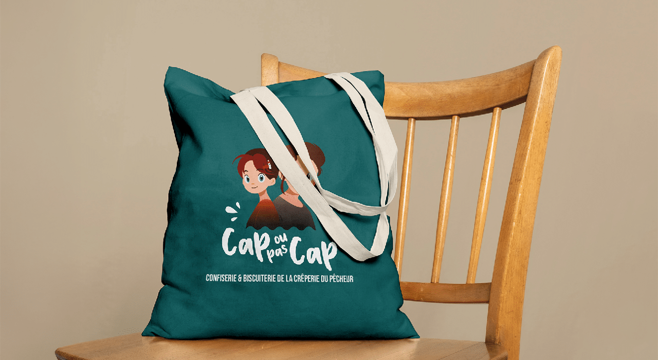Maquette du logo Cap ou pas Cap (biscuiterie de la Crêperie du Pêcheur à Erquy) par Mathilde Vassallo pour Carton Graphique.